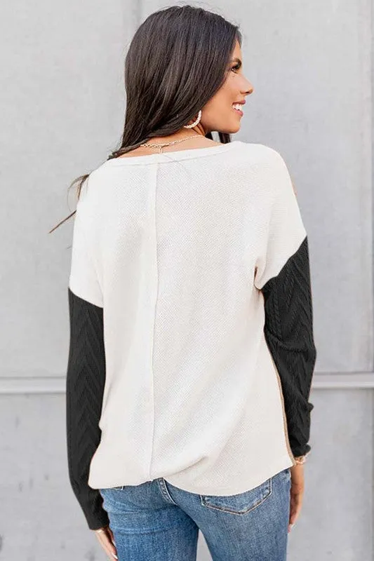 Cable knit color block round neck sweater